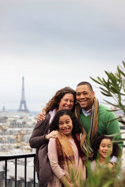 Wear a black long sleeve shirt woman holding a brown scarf girl
